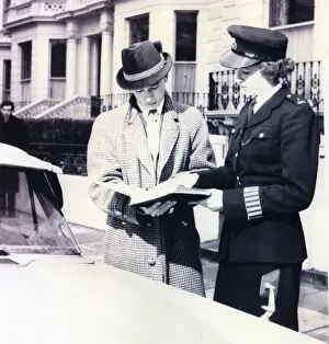 Trendy Prints: Woman police officer helping a driver, London