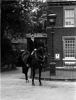 Woman police officer on horseback, London