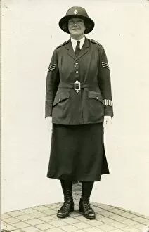 Buttoned Collection: Woman police officer posing in uniform, London