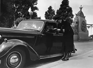 Kerb Prints: Woman police officer standing by car, Hammersmith, London