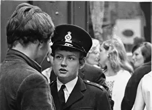 Woman police officer in street, London