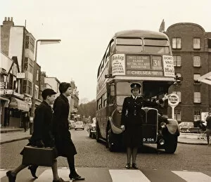 Woman police officer on traffic duty, London