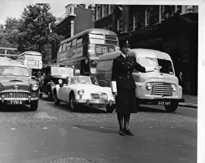 Woman police officer on traffic duty, London