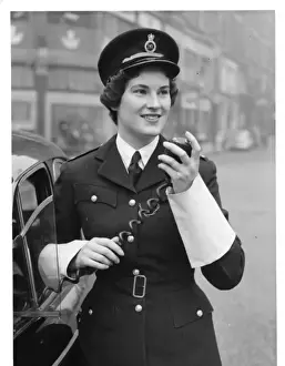 Woman police officer on traffic duty, London