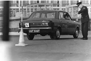 Woman police officer undergoing driving training