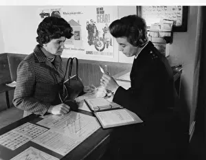 Woman police officer working at a police station