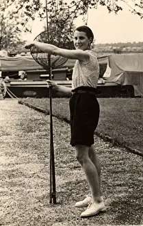 Woman poses with fishing nets