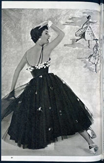 Garments Collection: A woman posing in a summer dress. Date: 1954
