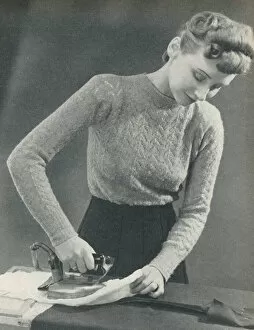 Images Dated 5th July 2019: Woman pressing a seam under a damp cloth