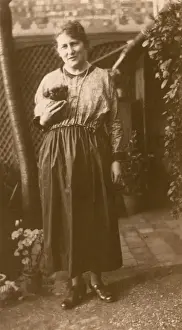 Pekingese Prints: Woman and puppy in a garden