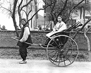 Rickshaw Collection: Woman in rickshaw, China