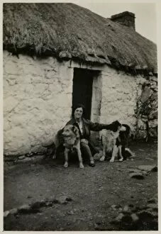 Woman in Scotland with two collie dogs