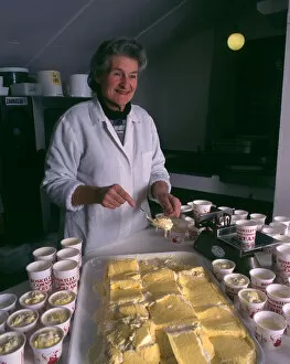 Images Dated 25th November 2016: Woman serving Roskillys Cornish Clotted Cream