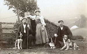 A woman, two shepherds and three sheepdogs