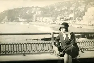 Thought Prints: Woman sitting on a bench at the pier