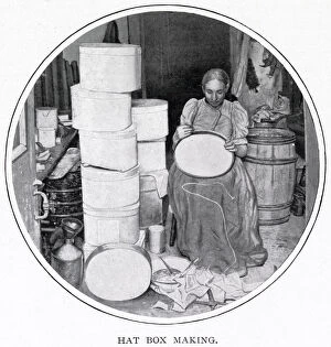 Images Dated 23rd November 2020: Woman sitting in her own home in South London, making the hat boxes for a supplier that