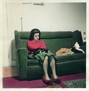 Spooky Prints: Woman in slippers seated on sofa
