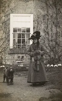 Walkies Prints: Woman with spaniel dog outside a house