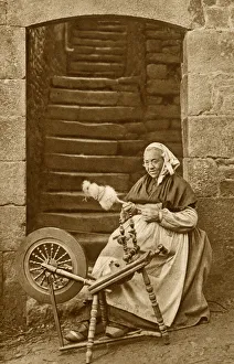 Images Dated 28th August 2018: Woman at a spinning wheel, Dinan, Brittany, Northern France