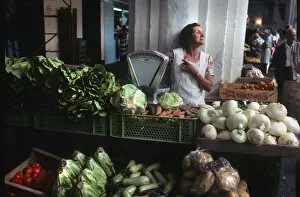 Menorca Gallery: A woman stallholder behind her vegetable stall, Menorca