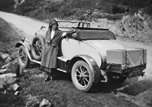 Topped Prints: Woman standing in front of car