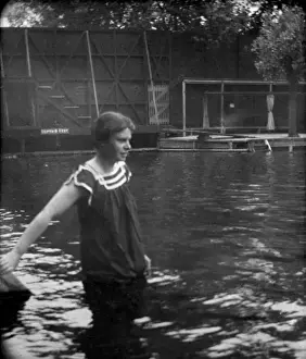 Woman standing in swimming pool