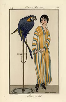 Woman in striped nightgown with pet parrot