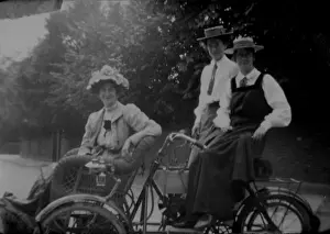 Motorised Prints: Woman and students on motorised bicycle