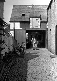 Chore Prints: Woman sweeping a yard