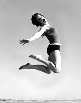 Jump Prints: Woman in swimsuit jumping