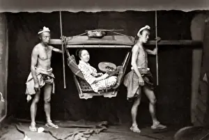 Woman in a travelling chair or Kago, Japan circa 1870s. Date: circa 1870s