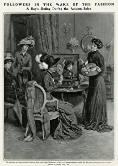 Choosing Gallery: Woman trying on an array of hats in the Autumn sale 1909