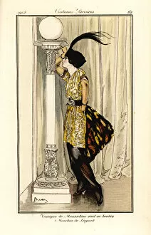 Antongini Gallery: Woman in tunic dress of gold-eye embroidered chiffon