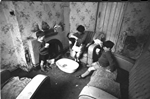 Woman bathing baby, Falls Road, Northern Ireland