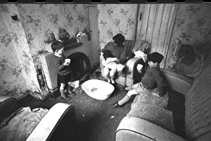 Woman bathing baby, Falls Road, Northern Ireland
