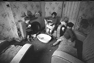 Woman bathing baby, Falls Road, Northern Ireland