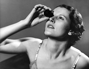 Images Dated 10th July 2012: Woman Using Eye Bath