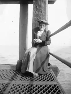 Woman waiting for ferry, Fishguard, South Wales
