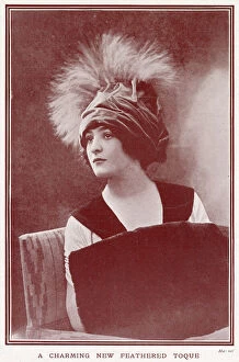 Buff Collection: Woman wearing a fashionable velvettoque hat with plumes of feathers. Date: 1911