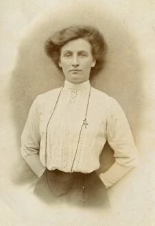 Broderie Gallery: Woman wearing a high-necked broderie-anglaise blouse