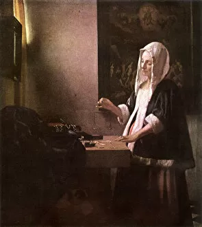 Images Dated 18th December 2017: Woman Weighing Gold by Jan Vermeer