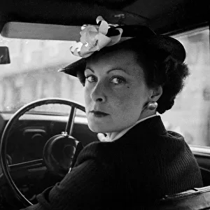 Images Dated 27th April 2021: Woman at the wheel of her car
