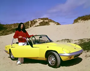 Dunes Prints: Woman with yellow sports car on a beach