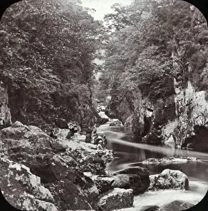 Women on the banks of a rocky stream, Wales