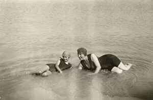 Two women bathing in the sea, Normandy, France