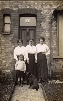 Three women and a boy with a dog