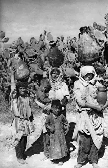 Women carrying water, Holy Land