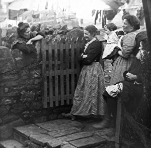 Women chatting in a back yard, Pontypool, South Wales