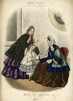 Two women and a child in the latest French fashions