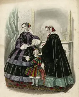 Two women and a child in the latest French fashions
